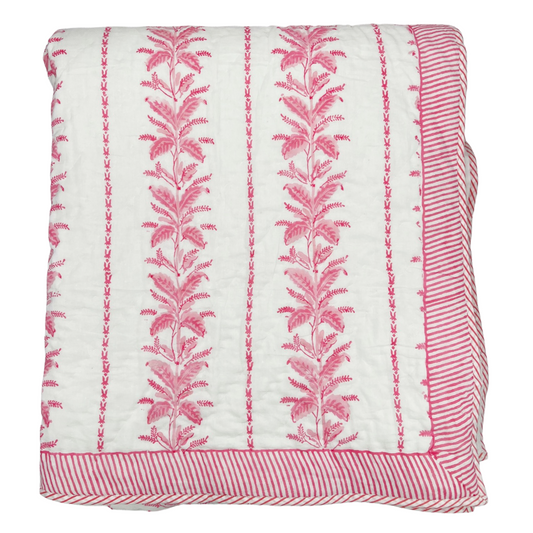 Block print cotton quilt featuring a botanical floral pattern insprired by the climbing fern pattern of an antique wallpaper. This traditional spin on Indian artisan techniques is available in twin, queen, and king. 